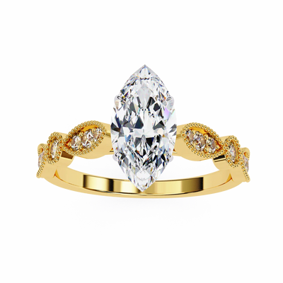 Gold ring with a large pear-shaped diamond and smaller diamonds on a white background