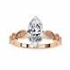 Rose gold ring with a large diamond and smaller diamonds on a white background