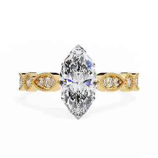 Gold ring with a large marquise-shaped diamond on a white background