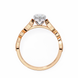 Rose gold ring with a diamond on a white background