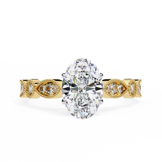 Gold ring with a large central diamond and smaller diamonds on the band against a white background