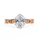 Gold ring with a large central diamond and smaller diamonds on the band against a white background
