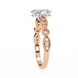 Rose gold ring with diamond accents on a white background