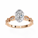 Rose gold ring with a large diamond and smaller diamonds on a white background