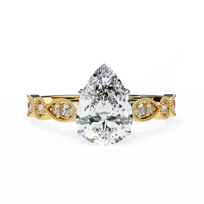 Rose gold ring with a pear-shaped diamond on a white background