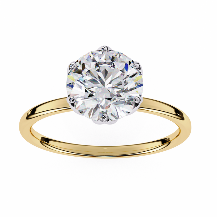Gold ring with a large diamond on a white background