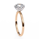 Rose gold ring with a diamond on a white background