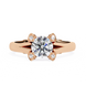 Rose gold ring with a large diamond and smaller diamonds on the band against a white background