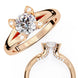 Rose gold ring with a large diamond and smaller diamonds on a white background