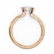 Rose gold ring with a diamond on a white background