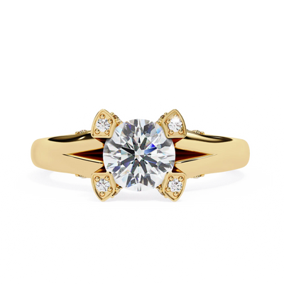 Gold ring with a large diamond and smaller diamonds on the band against a white background