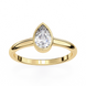 Gold ring with a pear-shaped diamond on a white background