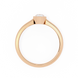Rose gold ring with a clear gemstone on a white background