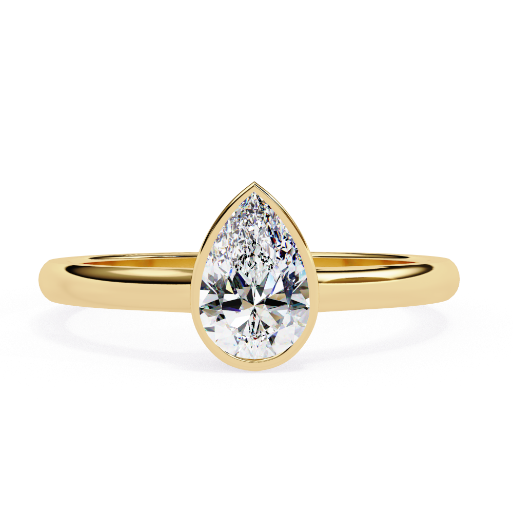 Gold ring with a pear-shaped diamond on a white background