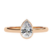 Gold ring with a pear-shaped diamond on a white background