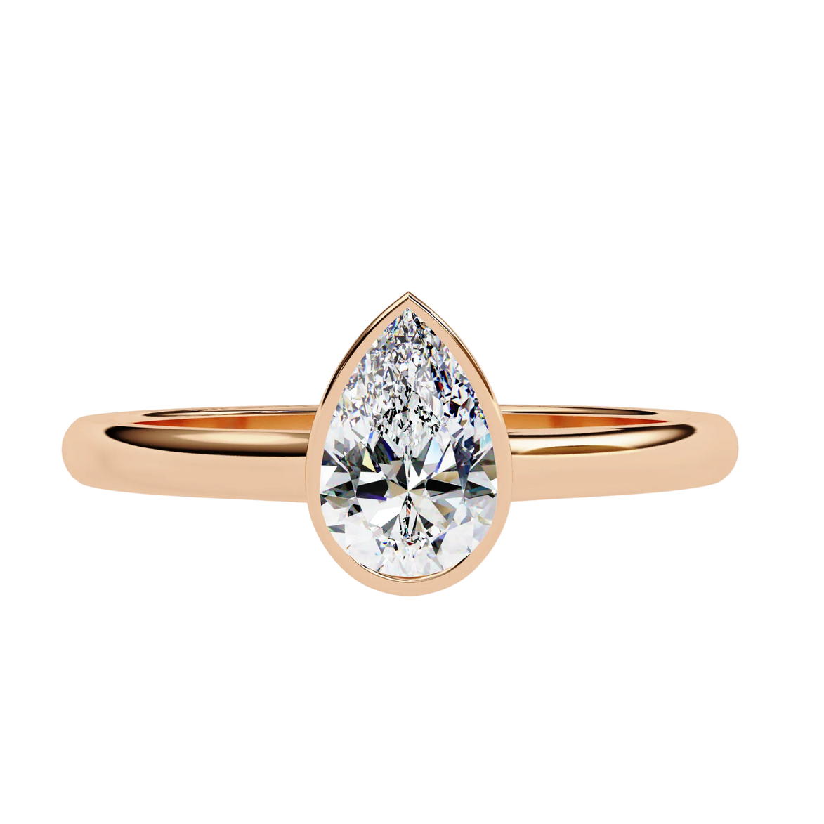 Gold ring with a pear-shaped diamond on a white background