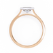 Rose gold ring with a diamond on a white background