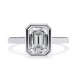 Diamond ring with emerald-cut gemstone on a white background