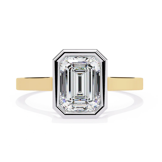 Diamond ring with yellow gold band on a white background
