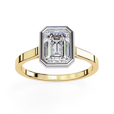 Gold ring with a large diamond on a white background