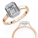 Rose gold ring with a large diamond and smaller diamond on a white background