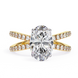 Gold ring with a large diamond and smaller diamonds on the band against a white background