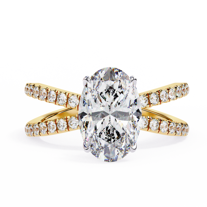 Gold ring with a large diamond and smaller diamonds on the band against a white background