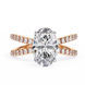 Diamond ring with rose gold band on a white background