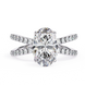Diamond ring with a large central gemstone and smaller stones on the band against a white background