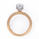 Rose gold ring with a diamond on a white background