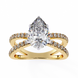Gold ring with a pear-shaped diamond and smaller diamonds on a white background