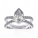 Diamond ring with a pear-shaped center stone on a white background