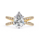 Gold ring with a pear-shaped diamond and smaller diamonds on a white background