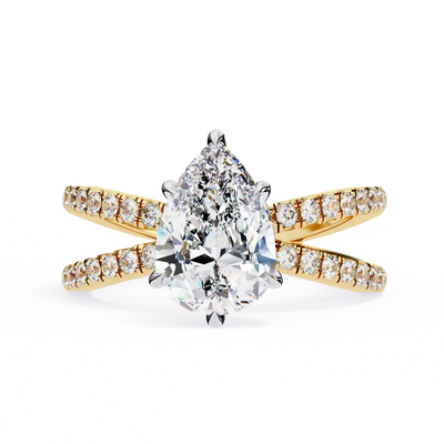 Gold ring with a pear-shaped diamond and smaller diamonds on a white background