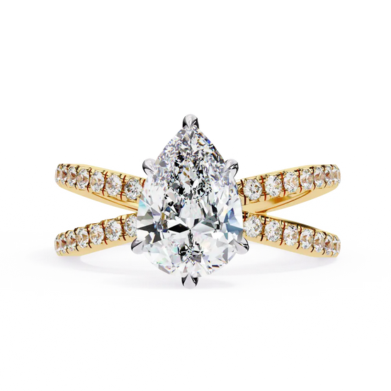 Gold ring with a pear-shaped diamond and smaller diamonds on a white background