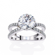 Silver ring with a large central diamond and smaller diamonds on the band against a white background