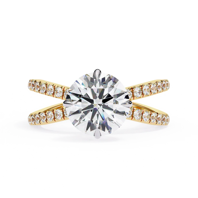 Gold ring with a large diamond and smaller diamonds on the band against a white background
