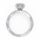 Diamond ring with a heart-shaped center stone on a white background