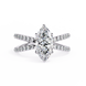 Diamond ring with a pear-shaped center stone on a white background