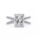 Diamond ring with a large central gemstone and smaller stones on the band against a white background