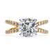 Gold ring with a large diamond and smaller diamonds on the band against a white background