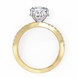 Gold ring with a heart-shaped diamond on a white background
