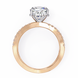 Rose gold ring with heart-shaped diamond on a white background