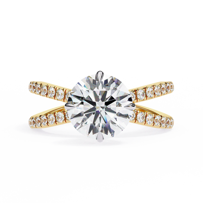 Gold ring with a large diamond and smaller diamonds on the band against a white background