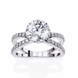 Silver ring with a large central diamond and smaller diamonds on the band against a white background