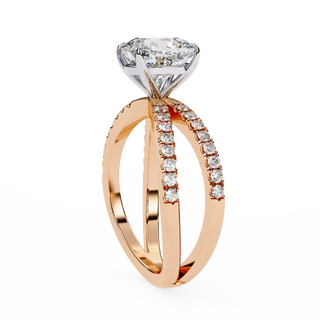Rose gold ring with a large diamond and smaller diamonds on the band against a white background