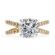 Gold ring with a large diamond and smaller diamonds on the band against a white background