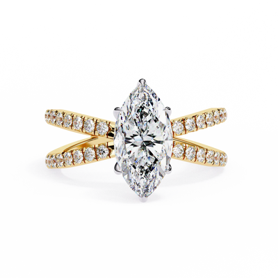 Gold ring with a large diamond and smaller diamonds on the band against a white background