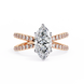Rose gold ring with a large diamond and smaller diamonds on the band against a white background