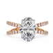 Diamond ring with rose gold band on a white background